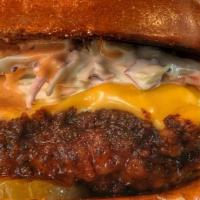 Nash Me Up Chicken · Fresh marinated chicken fried patty dipped in Nashville sauce, topped with American cheese, ...