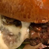 Shroom Burger · Beef patty, with aged melted swiss cheese, with arugula, sauteed mushrooms, tomatoes, onions...