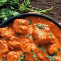 Butter Chicken · Chicken tossed with seasoned sautéed onion, tomato, ginger and garlic paste and then cooked ...