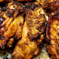 Jerk Chicken · Chicken Marinated and Grilled in Jamaican Jerk Seasoning - Served with Jamaican Hard Dough B...