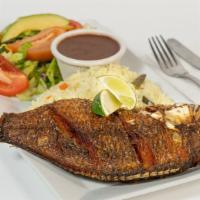 Pescado Frito / Whole Fried Fish · Whole fried tilapia, served with rice, refried beans, salad, pico de gallo, cheese, two tort...
