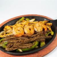 Fajitas · Sizzling stripped peppers, onions and tomatoes with your choice of stripped steak, chicken, ...