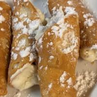 Cannolis · Four cannolis filled with delicious vanilla cream that's accented with chocolate chips and d...