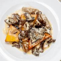 Polenta Croccante · Crispy polenta triangles with wild mushrooms and rosemary cream sauce
