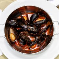 Cozze Marinara · Whole Chilean mussels steamed in spicy tomato sauce