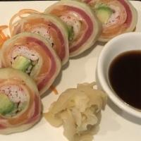Naruto · Tuna, salmon, kani, avocado rolled in thin sheet of cucumber.