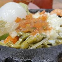 Marranito Plate · Beef fajita, chicken fajita, shrimp. with ranchero sauce, rice, charro beans, salad & guacam...
