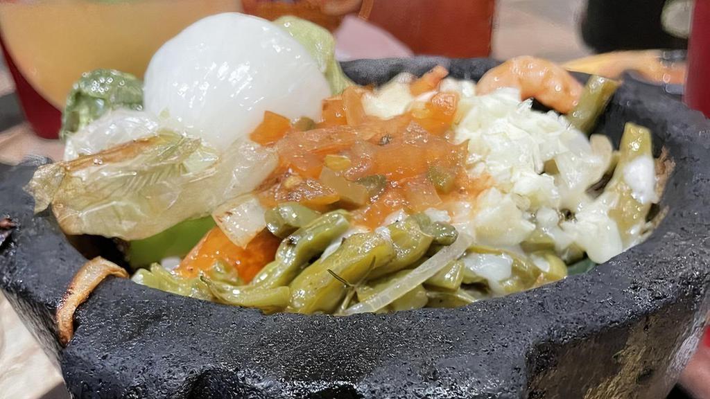 Marranito Plate · Beef fajita, chicken fajita, shrimp. with ranchero sauce, rice, charro beans, salad & guacamole.