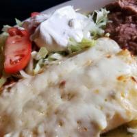 Enchiladas Verdes · Green enchiladas cheese or chicken, rice, beans, Monterrey Jack cheese, sour cream & salad.