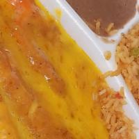 Plato Mexicano · (2) Enchiladas, (1) crispy taco, rice & beans.