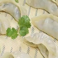 Steamed Dumplings / 물만두 · Homemade with beef, pork, vegetables, and sweet potato noodles.