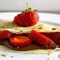 Nutella Strawberry Love · Nutella, sliced strawberries, whipped cream, powdered sugar.