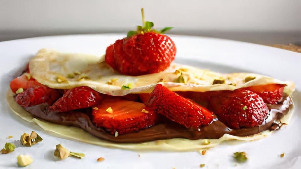 Nutella Strawberry Love · Nutella, sliced strawberries, whipped cream, powdered sugar.