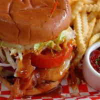 Backfire Burger · Four-alarm sauce, cheddar, pepper jack, bacon, lettuce, tomato, pickles, mayo and onion on a...
