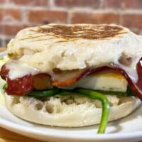 Grilled Caprese Sandwich · Freshly sliced tomato, basil, and mozzarella cheese grilled and melted to perfection.