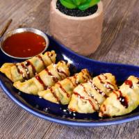 Veggie Pot Stickers · 5 fried vegetable dumpling topped with house  sauce.