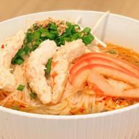 Tom Yum Noodles Soup · (Gluten-free)  Clear herbs hot & sour broth with rice noodles topped with chopped scallions,...