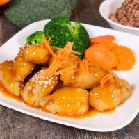 Orange Soy Chicken Or Tofu · Tempura soy chicken or tofu topped with fresh orange sauce, steamed carrots, broccoli, and s...