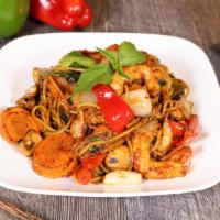 Spaghetti Basil With Seafood · Stir fried spaghetti in brown sauce with vegan shrimp and fish, carrots, onion, ginger, bell...
