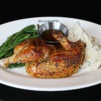 Wood-Fired Rotisserie Chicken · Slow-roasted to bring you maximum flavor. Served with mashed potatoes and green beans.