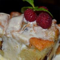 Bread Pudding · Chunky French bread and raisins, mixed with a sweet Grand Marnier cream custard, topped with...