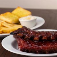Full Slab Ribs · Full slab of ribs served with cole slaw and French fries. 2520 cal.
