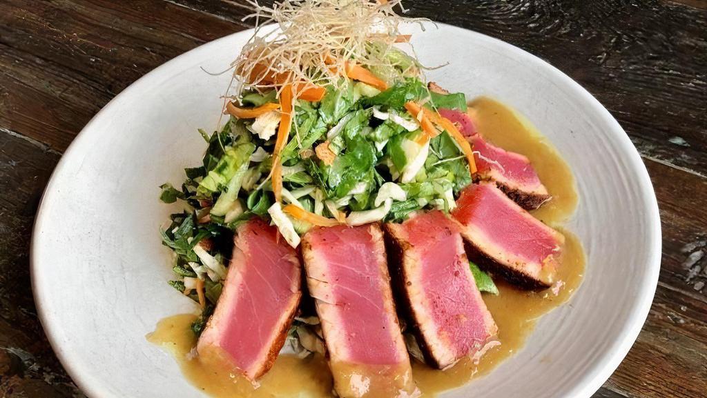 Seared Ahi Tuna Salad · sushi grade tuna, dusted with spicy pepper
seasoning, served over asian salad with
soy onion dressing