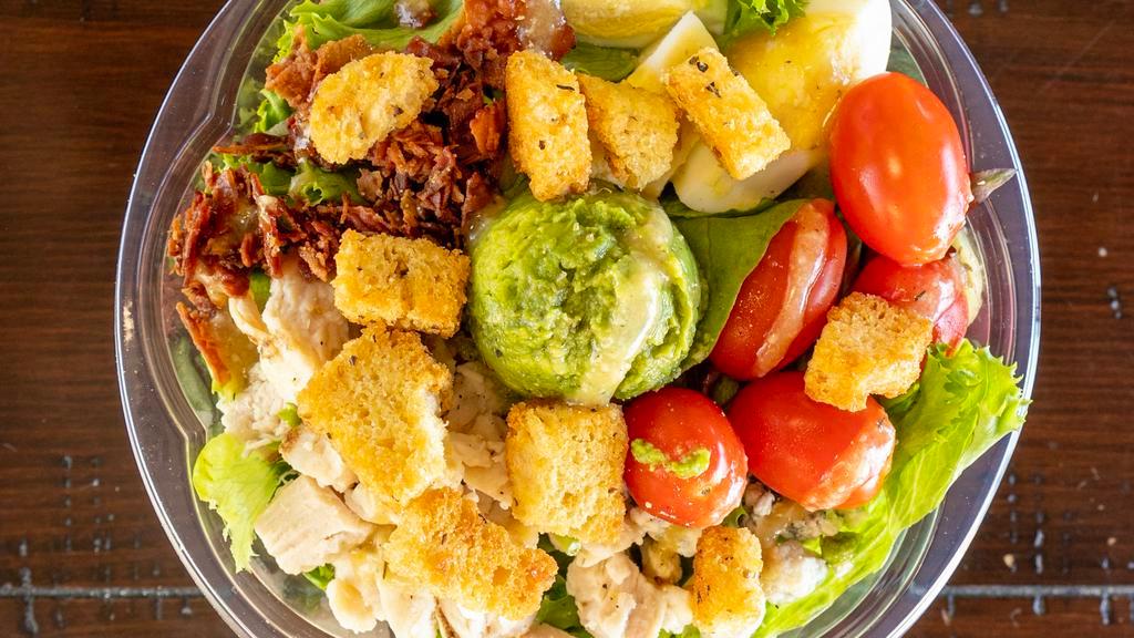 Cobb Salad Combo · Mixed greens, grilled diced chicken, bacon, sliced egg, diced tomatoes, croutons, avocado, and blue cheese crumble with a ranch dressing on the side. Extra dressing for an additional charge. Served with a fountain drink and giant cookie.