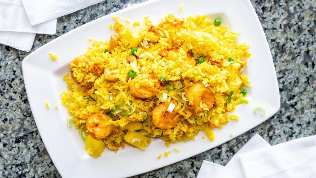 Thai Fried Rice · Curry flavor rice stir-fried with shrimp, pineapple, egg, cashews and vegetables.