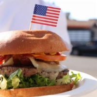 All American · 1/3lb Angus Prime Sirloin pattie with bacon and cheddar cheese topped with grilled onion, le...