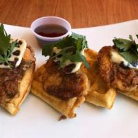 Fried Chicken & Waffles · Fried buttermilk chicken on a brussel style waffle. Served with date butter and syrup. Add b...