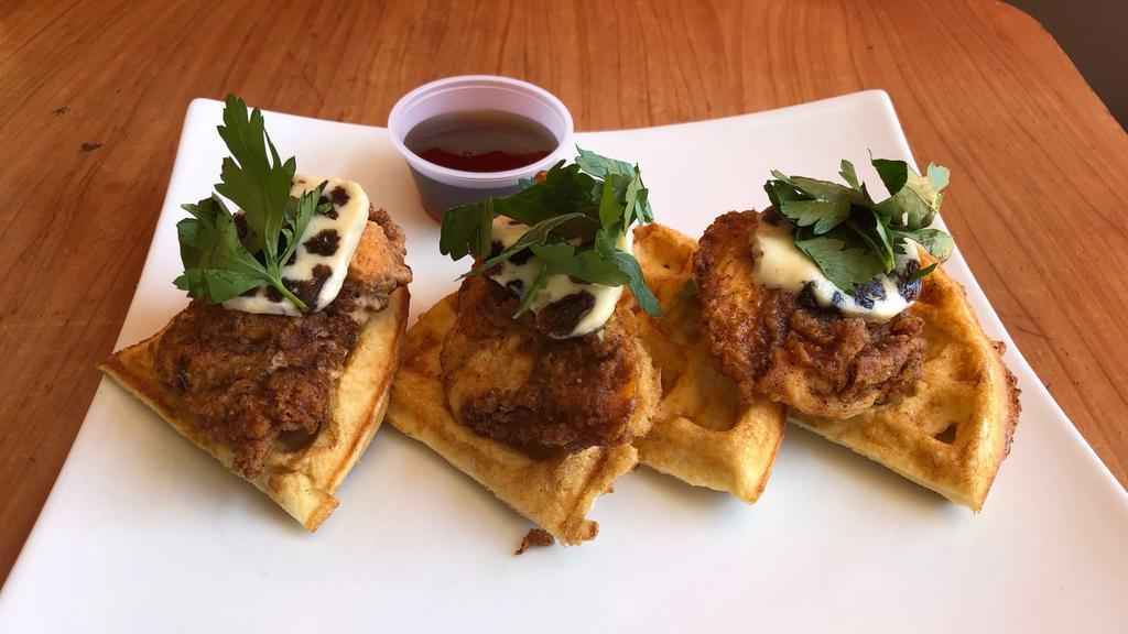 Fried Chicken & Waffles · Fried buttermilk chicken on a brussel style waffle. Served with date butter and syrup. Add bacon, egg, or 2 eggs for an addition. Please contact the merchant for extra addition selection.