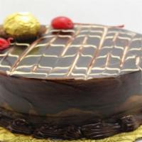 Round Vanilla And Chocolate Cake · Yellow Cake w/Chocolate Filling and Whipped Cream Icing covered w/ Chocolate Glaze.Please ca...