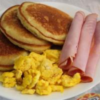 Pancakes · w/2 Eggs,Choice of Bacon,Sausage or Ham,Choice of Sm. Reg. Coffee,Sm. Reg.Tea or Sm.6 oz. Tr...