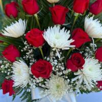 Red And White  · A beautiful arrangements with red roses, white spider mums, gypsum and greens on a vase. Col...