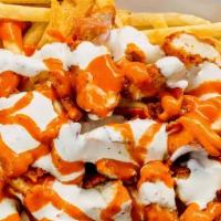 Tylor Fries · A pile of fries topped with crispy chicken, bacon, buffalo sauce, and bleu cheese dressing.