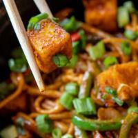 Tofu Stir Fry · Vegan. This spicy-sweet noodle dish is made with tofu, bell peppers, and onion, topped with ...