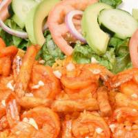 Camarones Al Mojo De Ajo · Delicious shrimp sauteed in a special garlic and butter sauce server with Spanish rice, seas...