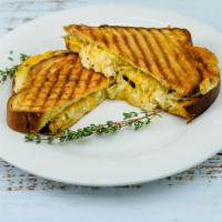 Crab Grilled Cheese · Garlic herb butter, 4 oz jumbo lump crab meat, gruyere, provolone & cheddar cheese, grilled ...