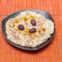 Hummus · Vegetarian option. Mashed chickpeas blended with tahini, olive oil, and lemon juice.