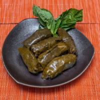 Dolmeh · Vegetarian option. Sweet and sour grape leaves stuffed with a tantalizing mixture of rice, f...