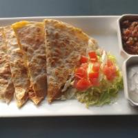 Classic Quesadilla · A flour tortilla with our house cheese blend and fresh pico de gallo with grilled onions and...