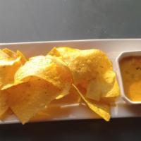 Chido Chips 'N Queso · Our house recipe chido queso & fresh tortilla chips.