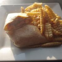 Buffalo Chicken Wrap · Grilled Chicken tossed in buffalo sauce and wrapped in a flour shell with ranch, lettuce & c...