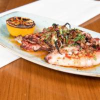 Kalamar · Grilled squid marinated in garlic, ginger, olive oil, Maras pepper, and oregano. Gluten-free...