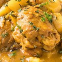 Jamaican Curry Chicken · Jamaican curried stew chicken cooked down in its own juices, with garlic and green onions.