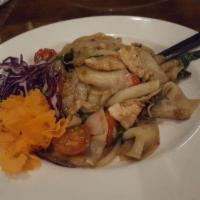 Drunken Noodles · Choice of meats : Stir-fried wide rice noodles with tomato, onion, bell pepper and sweet bas...