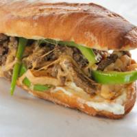 Mushroom Philly Cheesesteak · Tender steak, mushrooms, melted gooey cheese, and onions hugged by a toasted butter roll.