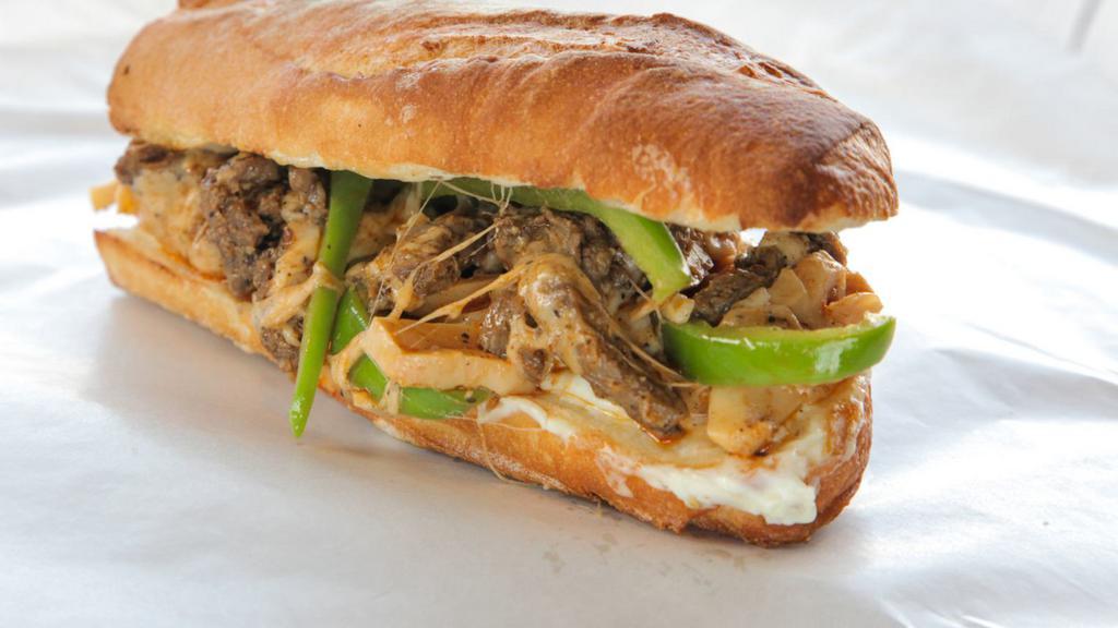 Mushroom Philly Cheesesteak · Tender steak, mushrooms, melted gooey cheese, and onions hugged by a toasted butter roll.