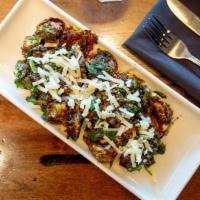 Brussels Sprouts · Flash fried, shaved parmesan, pecans, maple-balsamic syrup.